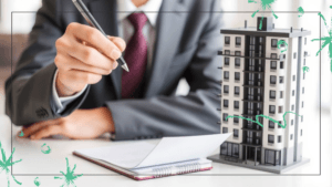 A person in a suit writes notes on a notepad beside a condo model.